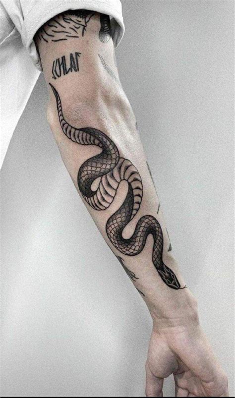 gucci snake tricep tattoo